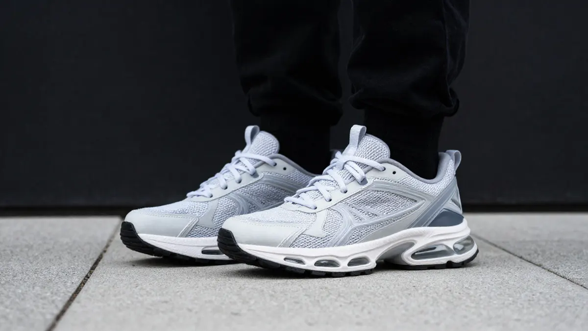 Close-up of a chunky running sneaker with visible wavy cushioning at the heel, a practical guide to the Air Max Plus TN